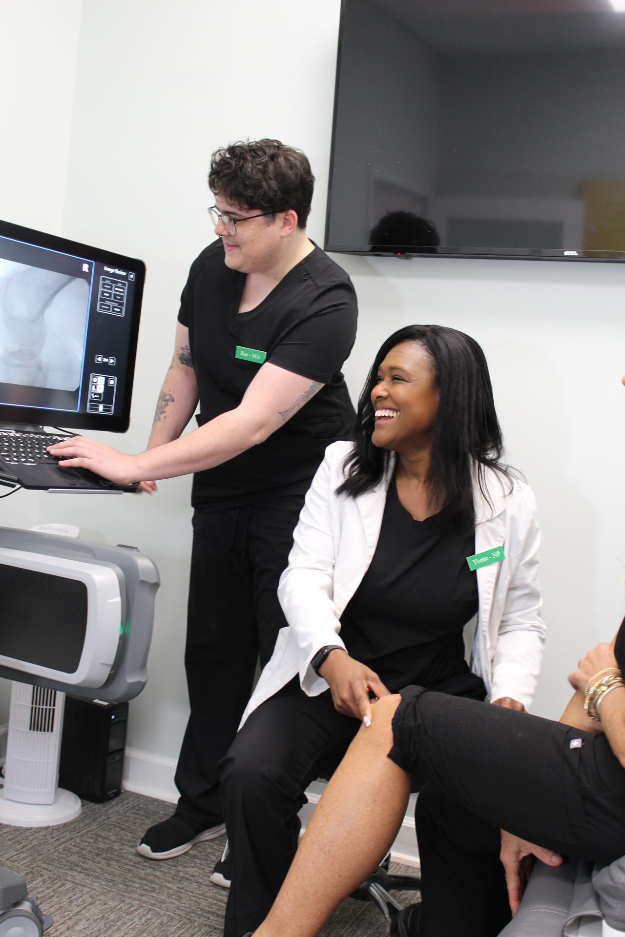 A Vitality provider and patient discussing care in the clinic.