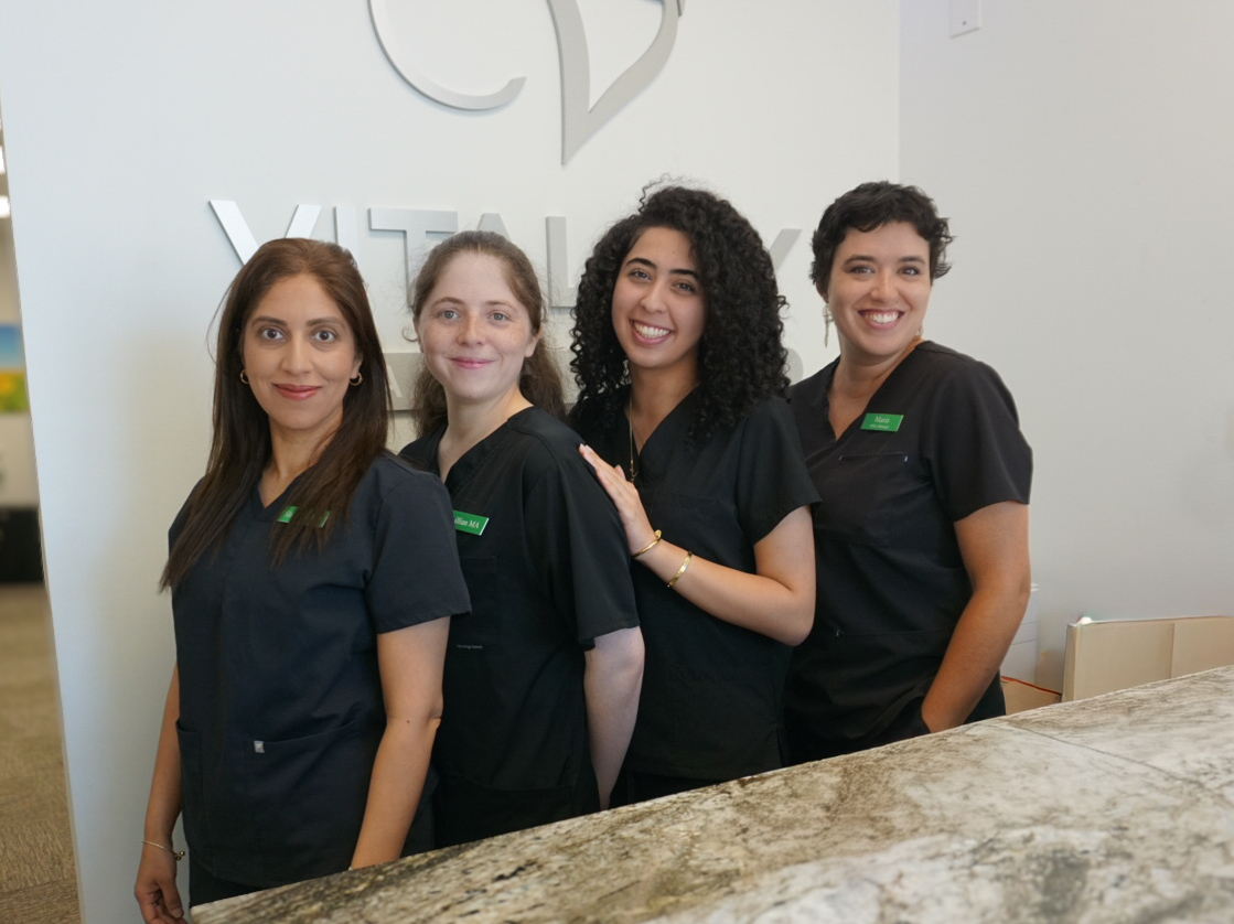 The Vitality Healing Center team together in the reception area.